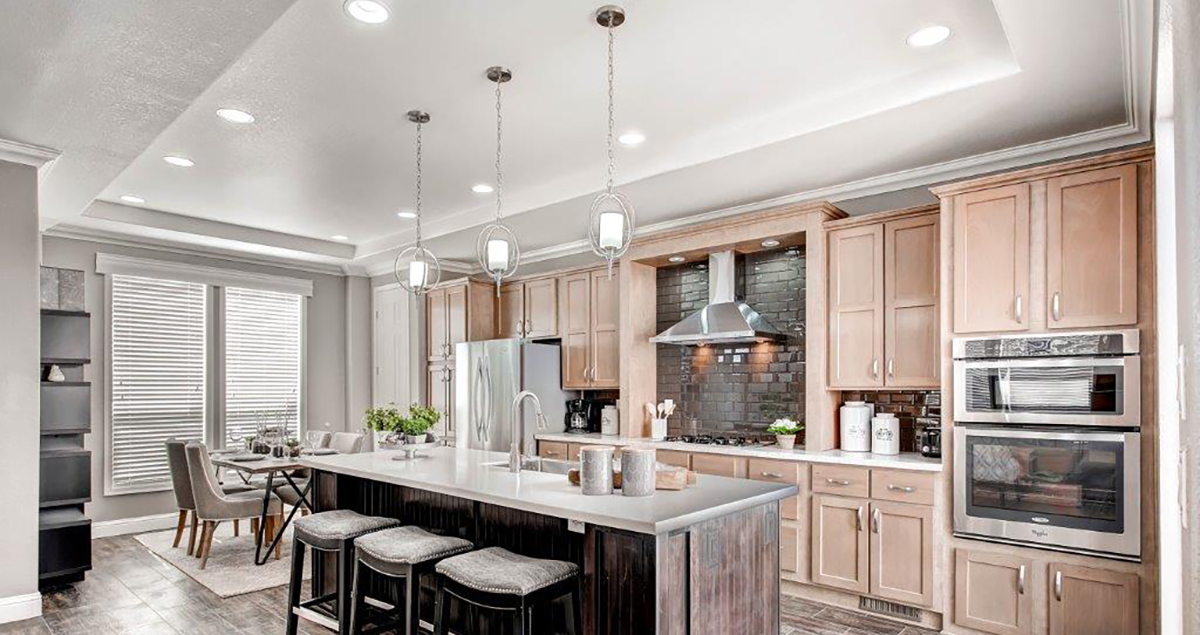 new modern manufactured home kitchen and dining room with large island